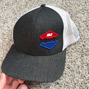 Black and White Mesh Trucker Hat with Red and Blue Logo